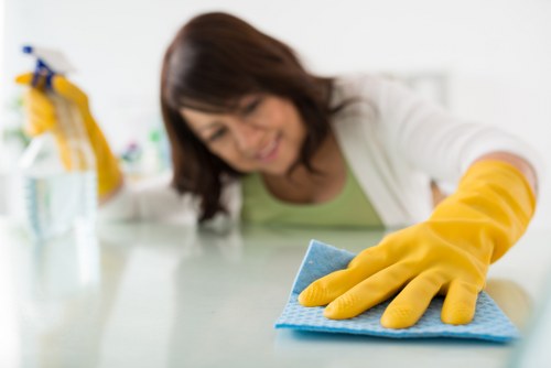 Local cleaner preparing a guest-ready bedroom in Ruislip
